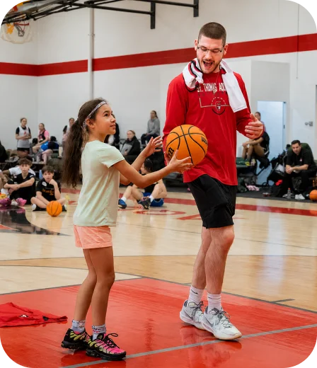 Coach training a young athlete